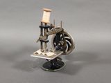 a small model of a sewing machine on a table