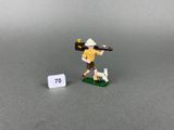 toy figurine of a man with a rifle and a dog on a board
