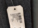 a close up of a label on a coat hanging on a wall