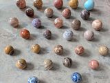 a lot of marbles that are on the floor