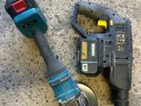 a cordless drill and a cordless hammer on the ground