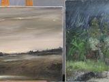 three paintings on easels that are sitting on a table