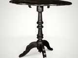 a black table with a wooden top on a white background