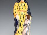 figurine of saint anne holding a child in her arms