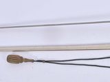 two different types of swords on a white surface