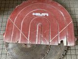 a circular saw on the floor of a bathroom