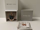 michael kors watch and wedding bands in a box