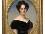 portrait of a woman in a black dress in a gold frame