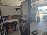 an image of a garage with a lot of tools in it