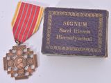 a small box with a medal and a medal on it