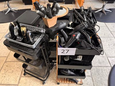 a pile of electronics on a cart in a store