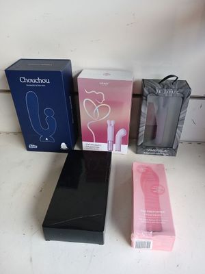 three boxes and one box of earphones on a table