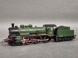 a toy train that is sitting on a gray surface