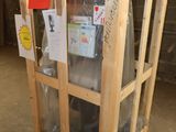 a wooden crate that has a glass door on top of it