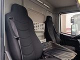 two seats in the back of a truck with a laptop on the seat