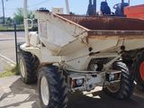 a tractor that is parked on the side of the road