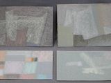four pieces of paper with different designs on them on a gray surface