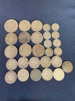 some of the coins are sitting on a blue surface