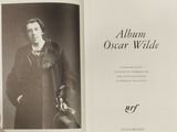 an open book with a black and white photo of a man in a coat