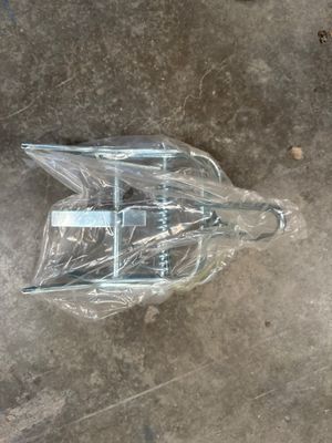 a plastic umbrella that is sitting on the ground