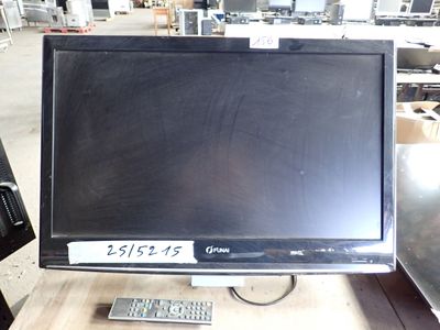 a computer monitor sitting on top of a wooden table