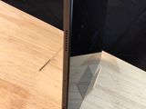 a cell phone that is sitting on a wooden table
