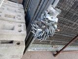a metal fence with a bunch of pieces of metal on it