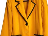 a yellow jacket with black trims and a black lapel collar
