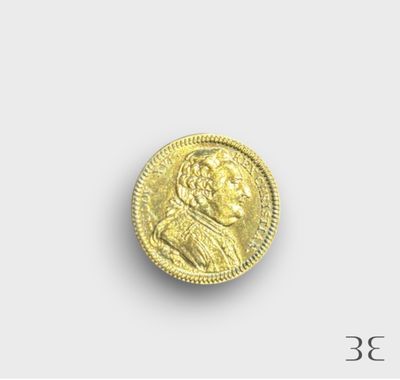 une pièce d'or portant le portrait d'un homme