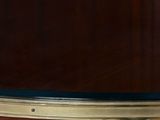 a close up of a wooden table with a glass top