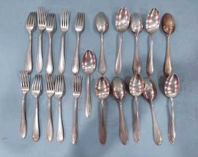 a lot of silver spoons and forks on the table