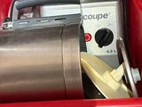 a red container with a mixer and a bowl in it