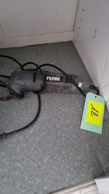 an image of a corded sander on the floor