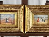 deux tableaux représentant un couple posé sur un chevalet en bois