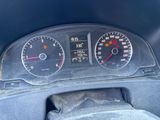 a close up of a car dashboard with a speedometer and gauges