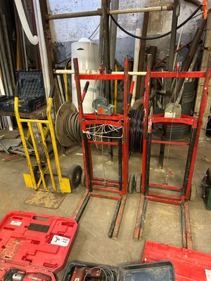 many tools that are sitting on the floor in the garage