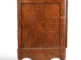 an old wooden cabinet with a drawer on top of it