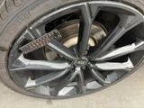 a close up of a tire that has a stick on it