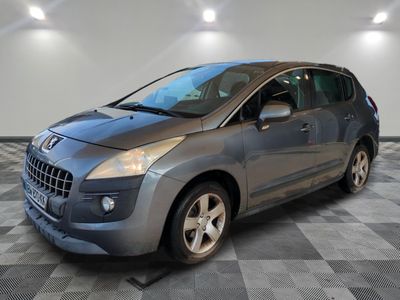 a picture of a silver car parked in a garage