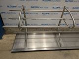 an image of a stainless steel sink in a room with a blue and white wall
