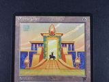 an image of a card with a picture of a cat in front of a gate
