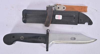 three different types of knives on a white surface