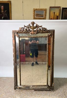 a man taking a picture of himself in a mirror