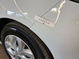 a white car with a sticker on the side of it