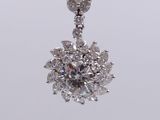 a close up of a diamond pendant on a white background