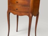 an image of a small wooden table with a drawer on it