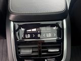 a car dashboard with a clock on the display