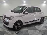 a picture of a small white car parked on a checkered floor
