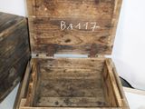 a small wooden box with a name written on it