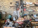 an image of a garage with a lot of clutter and tools